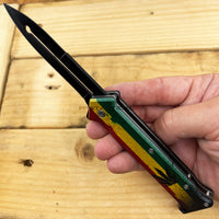 Pacific Solutions Marijuana Leaf Rasta Flag Spring Assisted Joker Stiletto Knife 3.75"
